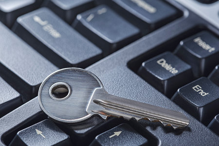 Protecting personal data and money , key on computer keyboard.の写真素材
