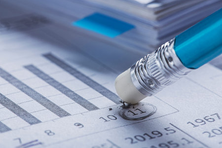 Accounting document with eraser erases blots in the document and checking financial chart. Concept...