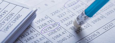 Accounting document with eraser erases blots in the document and checking financial chart. Concept...