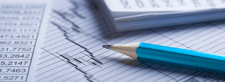 Checking the value of securities. Pencil, share listing and checking financial chart. Concept of...