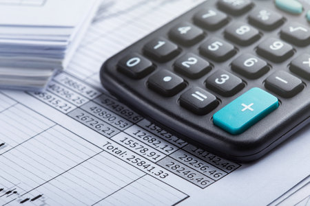 calculator and accounting document. Concept of banking, financial report and financial audit.の写真素材