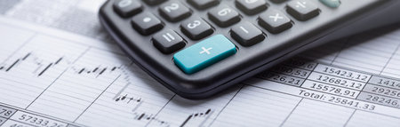 calculator and accounting document. Concept of banking, financial report and financial audit.の写真素材