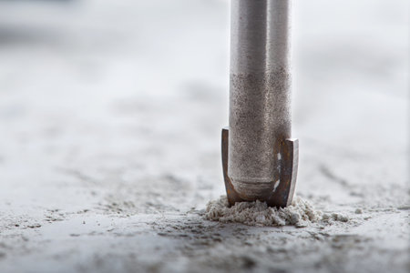 metal drill bit make holes in concrete wall with industrial drill. building work industry.の写真素材