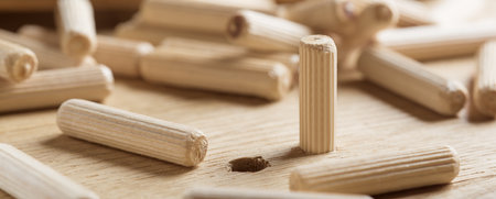 hole in wooden oak board for wooden dowel. carpentry industry.の写真素材