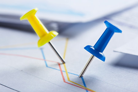 Marking financial chart by pins. Concept of banking, financial report and financial audit.の写真素材