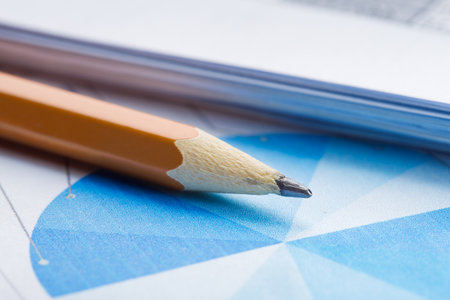 Accounting document with pencil and checking financial chart. Concept of banking, financial report and financial audit.の写真素材