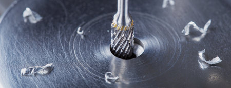 Milling cutter make sink in hole in steel billet. locksmith work.の写真素材