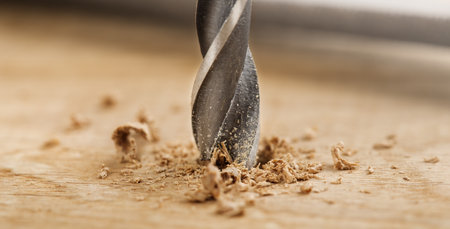 metal drill bit make holes in wooden oaks plankの写真素材