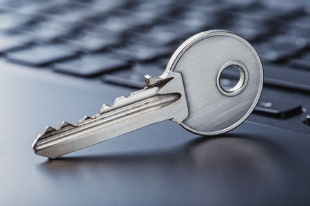 phishing, hacking personal data and money, key and hook on computer keyboard.