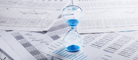 Best time for investment. Hourglass, financial charts and calculator.
