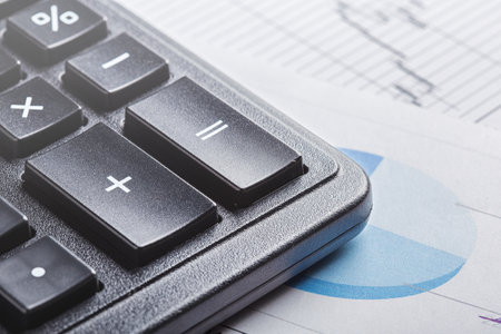calculator and financial charts. Investment and capital accumulation conceptの写真素材
