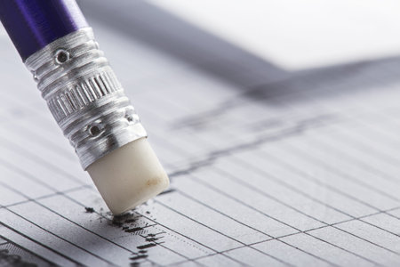 Fix with eraser financial data in document. Concept of banking, financial report and financial...
