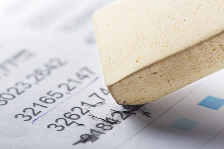 Fix with eraser financial data in document. Concept of banking, financial report and financial audit.の写真素材