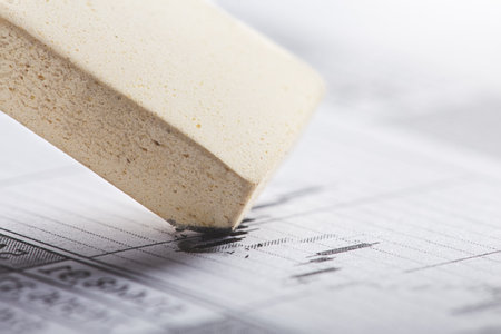 Fix with eraser financial data in document. Concept of banking, financial report and financial audit.の写真素材