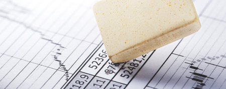 Fix with eraser financial data in document. Concept of banking, financial report and financial...