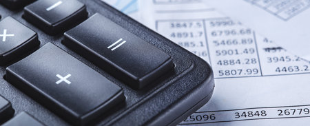 calculator and financial charts. Investment and capital accumulation conceptの写真素材