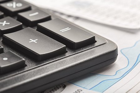 calculator and financial charts. Investment and capital accumulation conceptの写真素材