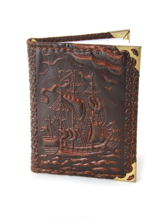 The brown note book on a white backgroundの写真素材