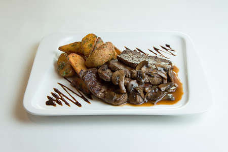 Grilled Meat Medallions with Berries Sauce and Fried Zucchiniの写真素材