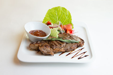 Grilled ribeye beef steak, herbs and spices. Top viewの写真素材