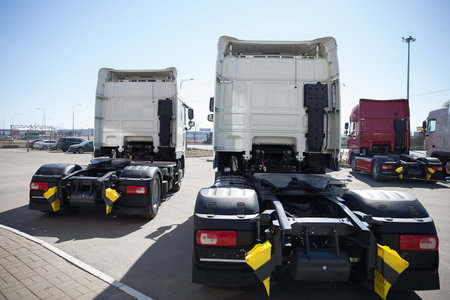 White trucks stand in lineの写真素材