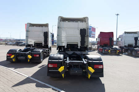 White trucks stand in lineの写真素材