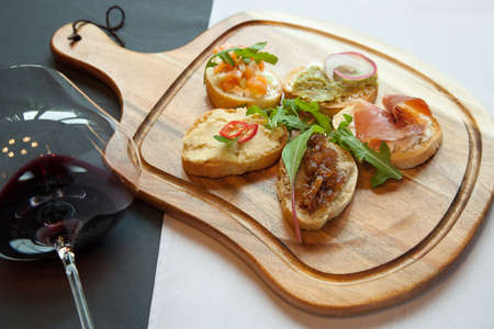Italian bruschetta is with assorted fillingsの写真素材