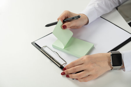 female hands write on the stickers choice of Yes or no Selects no, choose Yesの写真素材