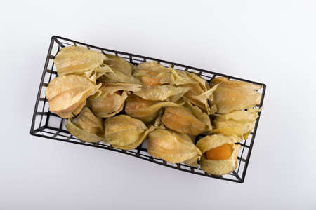 orange physalis berries in a box on a white background close-upの写真素材