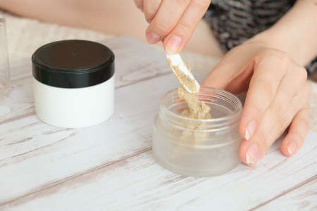 DIY cosmetics. hands in the frame create a cream of different ingredients.の写真素材