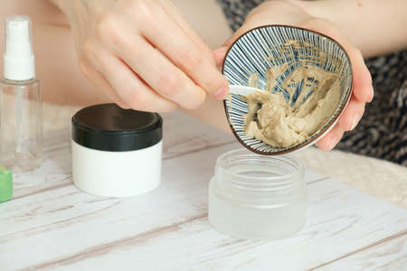DIY cosmetics. hands in the frame create a cream of different ingredients.の写真素材