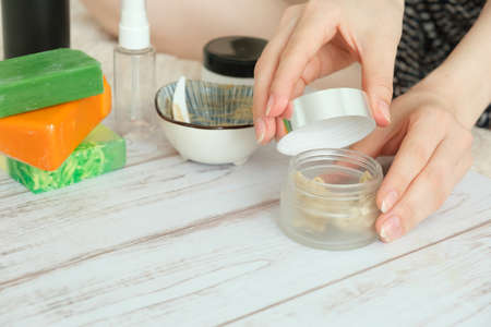 DIY cosmetics. hands in the frame create a cream of different ingredients.の写真素材
