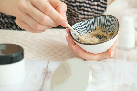 DIY cosmetics. hands in the frame create a cream of different ingredients.の写真素材