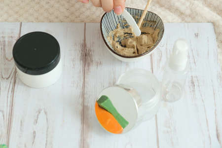 DIY cosmetics. hands in the frame create a cream of different ingredients.の写真素材