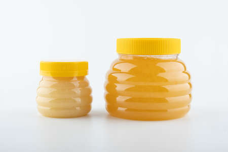 flower honey in large and small semolina on a white background close upの写真素材