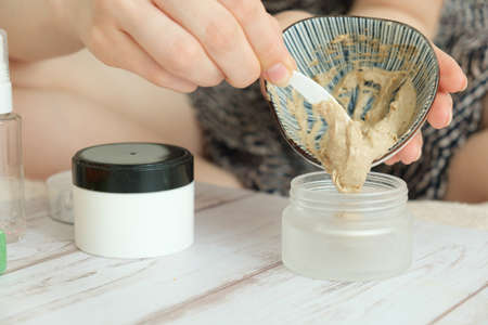 DIY cosmetics. hands in the frame create a cream of different ingredients.の写真素材
