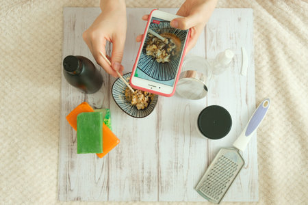 DIY cosmetics. hands in the frame create a cream of different ingredients.