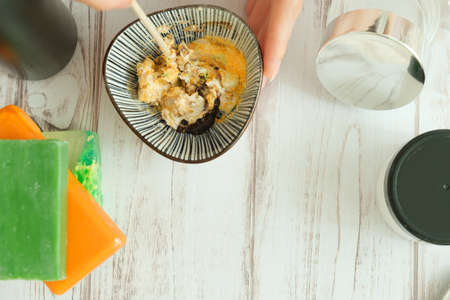 DIY cosmetics. hands in the frame create a cream of different ingredients.の写真素材