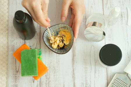 DIY cosmetics. hands in the frame create a cream of different ingredients.の写真素材