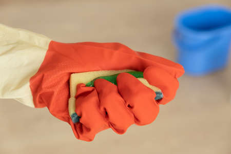  Hands in gloves for cleaning. The sponge with the detergent is foamed in the hand.の写真素材