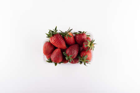fresh strawberries in box isolated on whiteの写真素材