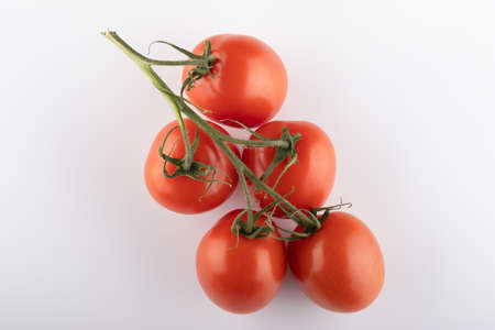Ripe Fresh Cherry Tomatoes on Branch Isolated on White Backgroundの写真素材