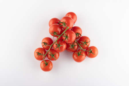 Ripe Fresh Cherry Tomatoes on Branch Isolated on White Backgroundの写真素材