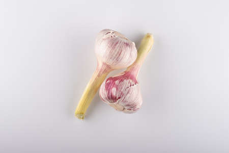 fresh heads of garlic close-up on a white backgroundの写真素材