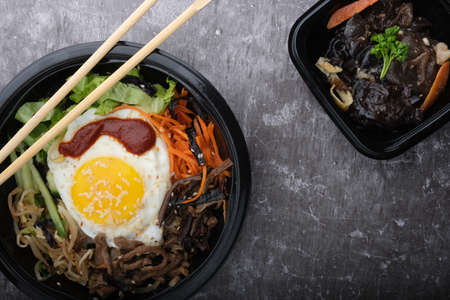  Korean dish, black mushroom salad. Top view close up. Near koreansike sticks and bibimbapの写真素材