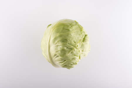 whole green cabbage swing closeup on a white backgroundの写真素材