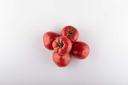 Ripe Fresh Cherry Tomatoes on Branch Isolated on White Backgroundの写真素材