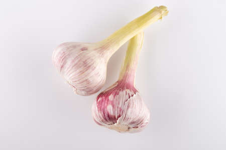 fresh heads of garlic close-up on a white backgroundの写真素材
