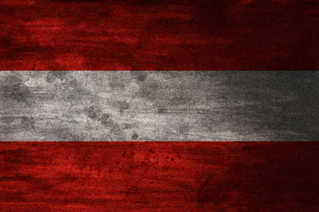 The flag of Austria has three equal horizontal bands of red top, white, and red. The Austrian triband is based on the coat of arms of the Babenberg dynasty, recorded in the 13th century. It may have seen use in flags from about the 15th century, alongsideの写真素材