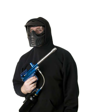 Man with paintball gun in black hoodie and maskの写真素材